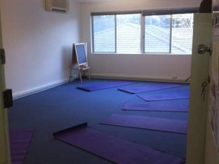 Fitness room with yoga mats on floor